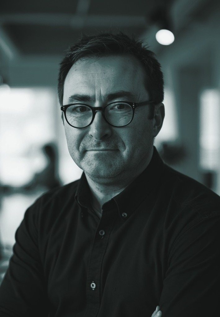 Portrait of Paul Mackenzie in teal duotone